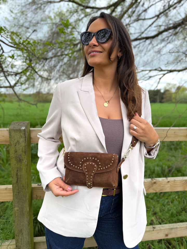 women wearing crossbody bag in chestnut brown suede