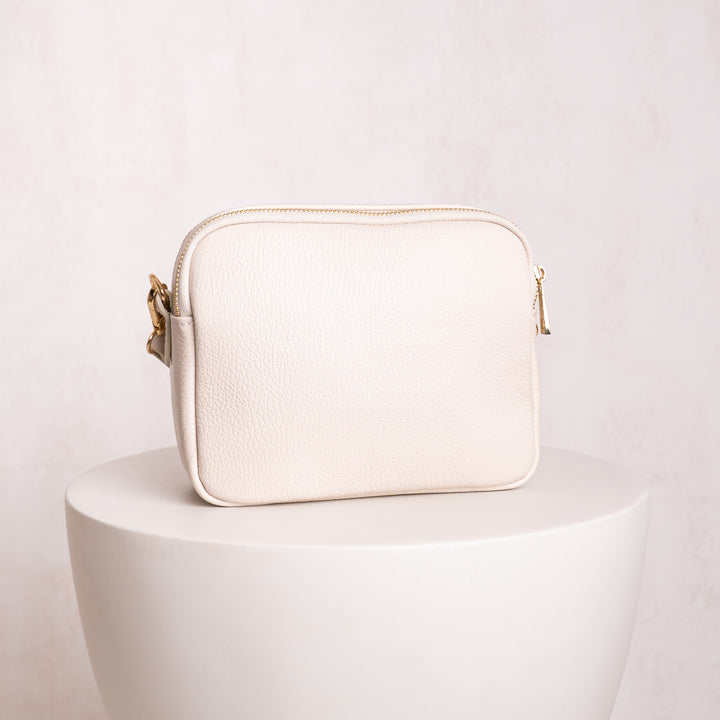 back of cream leather crossbody bag 
